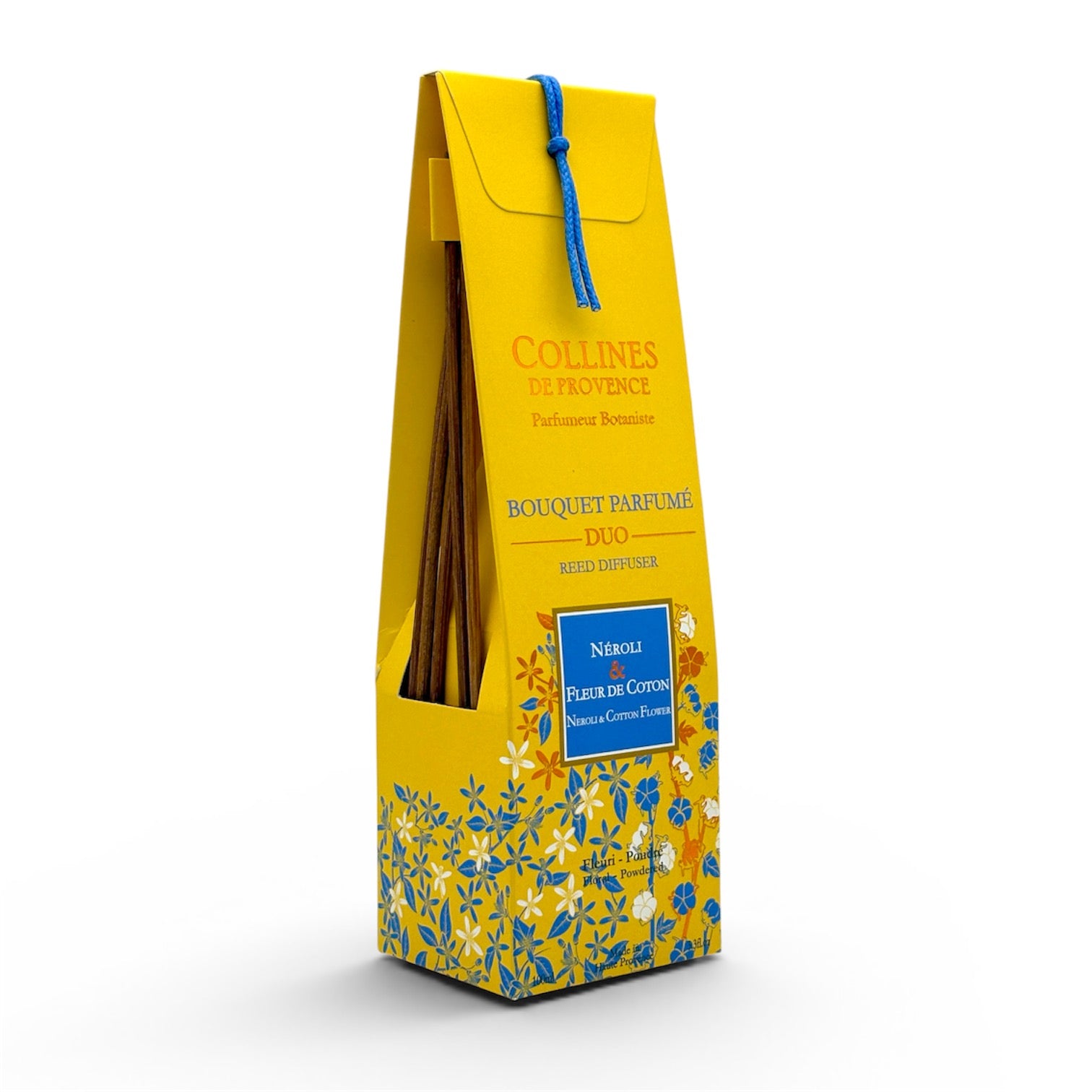 Bouquet parfumé artisanal Néroli et Fleur de Coton avec son packaging jaune et bleu et ses tiges de rotin.