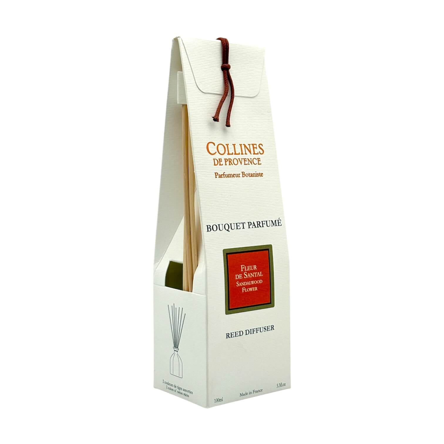 Diffuseur de parfum d'intérieur Fleur de Santal avec packaging blanc et oranges et tiges en rotin